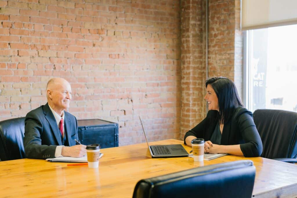 two business owners having a meeting about share restructuring