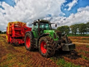 Image of a tractor and other farm machinery on a UK farm in relation to Agricultural Property Relief article