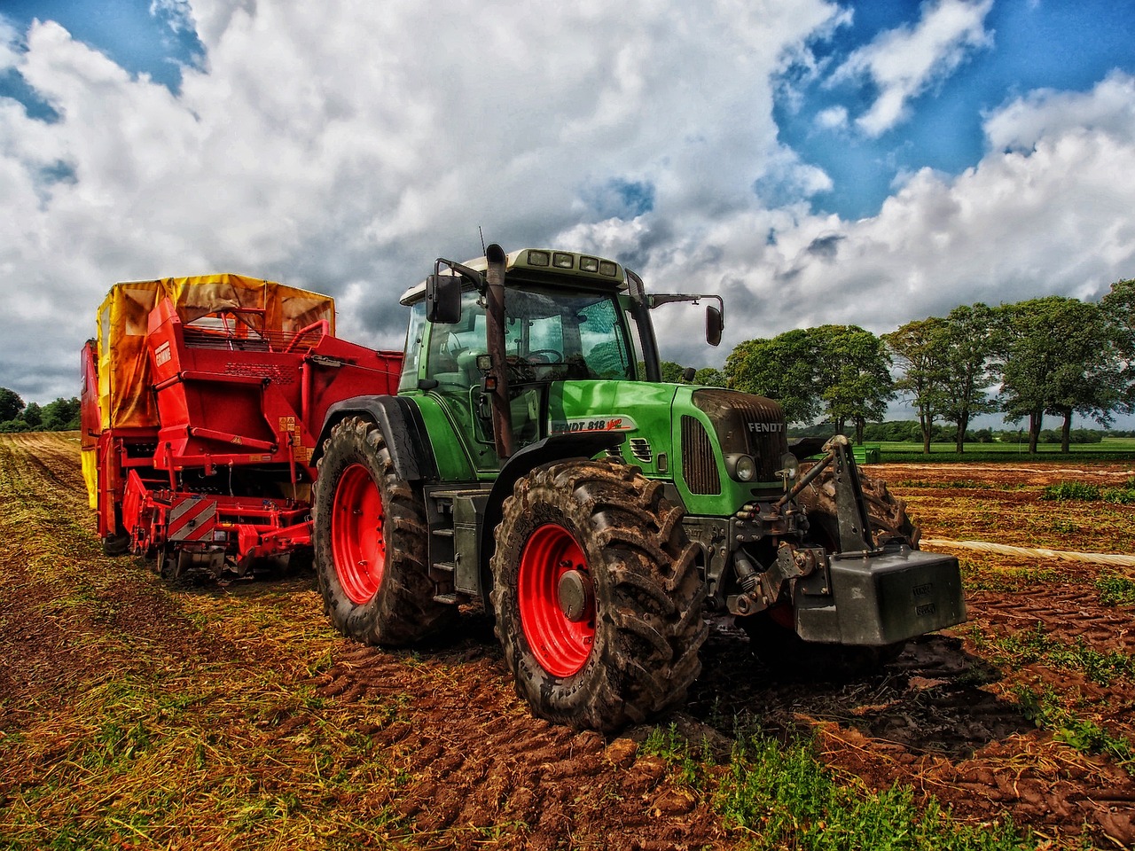 Image of a tractor and other farm machinery on a UK farm in relation to Agricultural Property Relief article